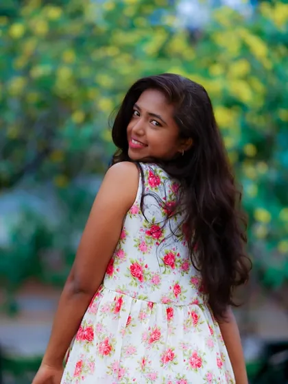 A simple floral dress in a sunlit park. This is the essence of a relaxed, natural light lifestyle session, perfect for capturing warm and joyful portraits.