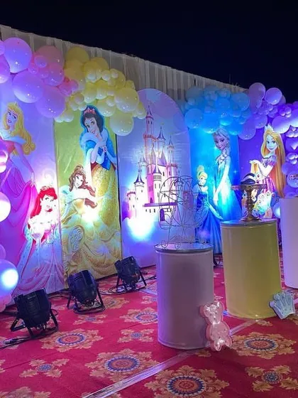 A side view of the princess stage, highlighting the balloon decorations and the individual princess panels.