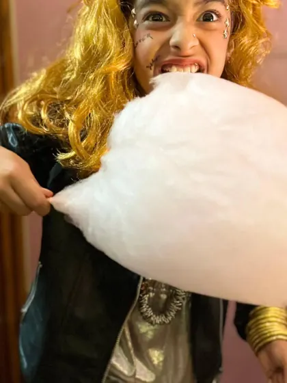 Another fun shot of our ghostly rockstar enjoying a sweet treat. The playful attitude is what makes these events so memorable.