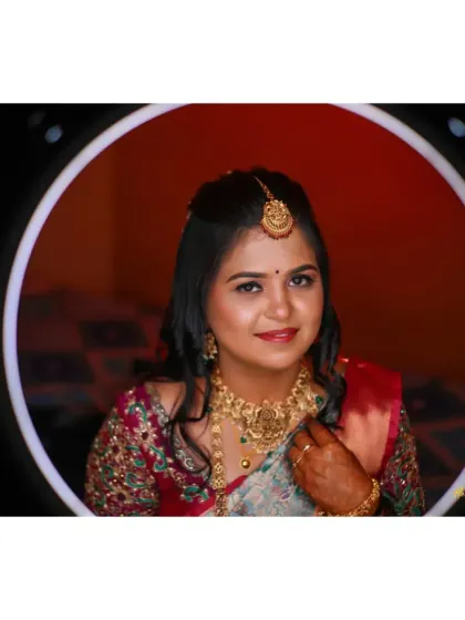 A lovely bridal portrait captured through a ring light, highlighting her happy expression and beautiful makeup.