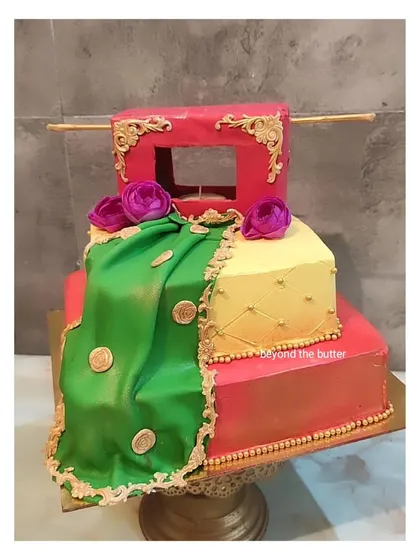 This vibrant Haldi theme cake was such a joy to create. I sculpted a fondant "doli" and a flowing green dupatta with gold coin details to capture the festive spirit of a traditional Haldi ceremony.