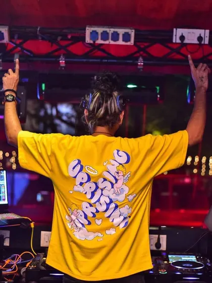 Let's rise and shine. A view from the back, with my hands up, ready to lift the energy of the entire room.
