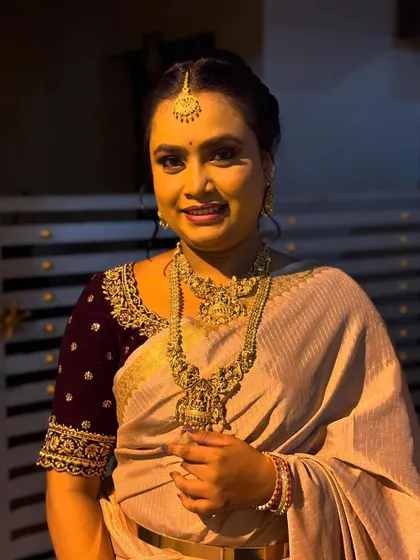 A full-view portrait from a creative bridal shoot. The elegant saree and jewellery are complemented by a makeup look that is both traditional and modern.