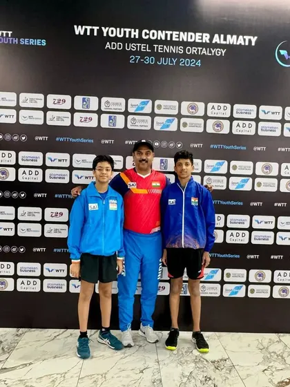 Our players Abhinav K Murthy and Reyansh Jalan with their coach in front of the official WTT Youth Series backdrop in Almaty, ready to compete against the world's best young talent.