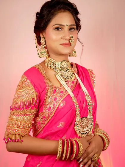 A confident and radiant portrait of the bride, showcasing her complete look. Her smile and pose exude happiness and grace.