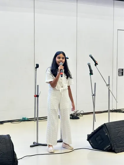 A young, talented singer performing at 'The Sound of Support' fundraiser. We aim to provide a platform for all our students.