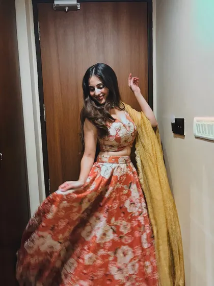 Another shot of the client, showing her joy and the beauty of her outfit.