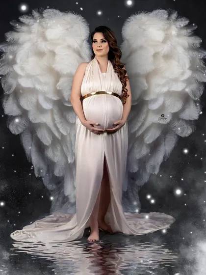 Another take on the angel wings theme, this portrait has a magical, ethereal feel. The white gown, starry night effect, and water reflection combine to create a beautiful fantasy image.