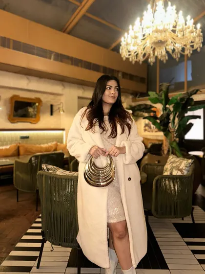 This outfit is perfect for a winter party, keeping you warm without sacrificing glamour.