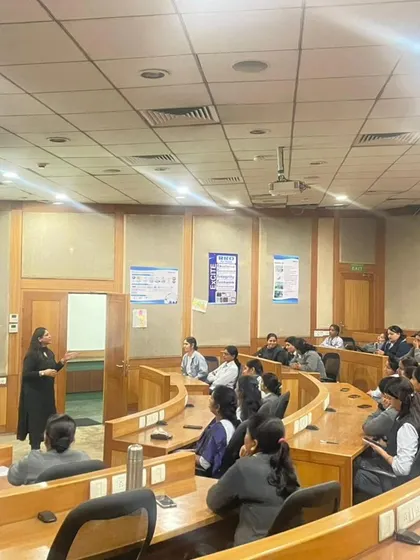The tiered classroom setup allows for great interaction. Here, I am addressing a question from the audience during a POSH compliance workshop.