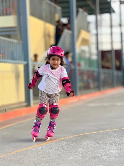 A young champion in the making, fully kitted out and focused during her race.