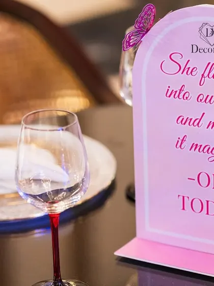 A duplicate of ID 2, a close-up of the personalized table sign for the butterfly-themed first birthday.
