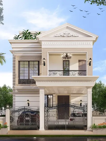 The wrought iron railings on the balcony and gates add a traditional charm that complements the neoclassical elements. Decorative lighting fixtures enhance the facade's sophistication.