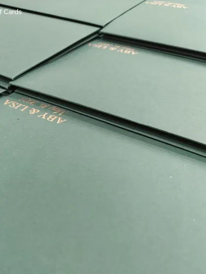 The simple and elegant envelope for the Glass Glow Green suite, with the couple's names printed in a matching gold foil.