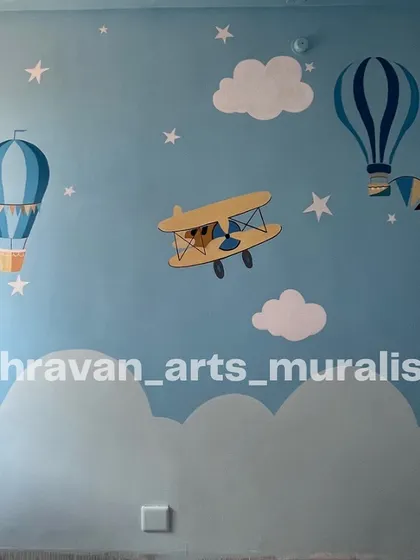 Children dream of flying high. This mural, with its airplanes and hot air balloons against a blue sky, is a reminder to never stop them from chasing their dreams.