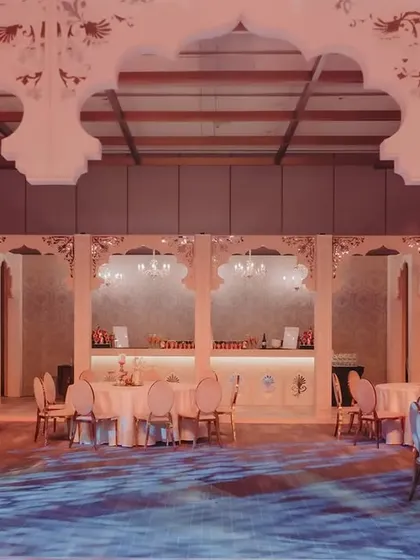 A full view of the ballroom, showcasing how the custom-built arches and stage design transformed the entire venue. The projected patterns on the floor mimic marble corridors, adding to the palatial feel.
