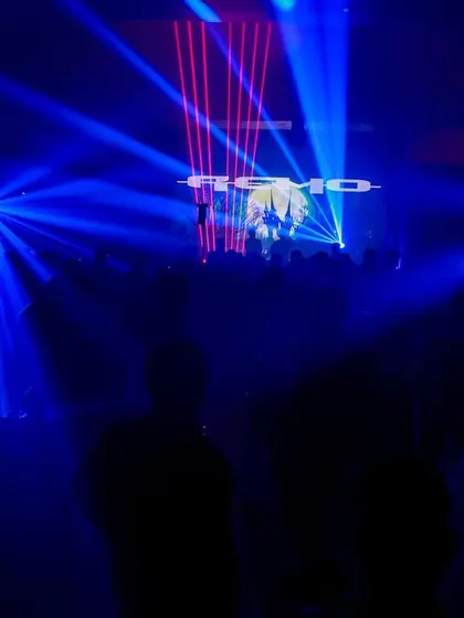 A full view of the laser light show creating a canopy over the crowd. This is the kind of festival-level production I can bring to your event.