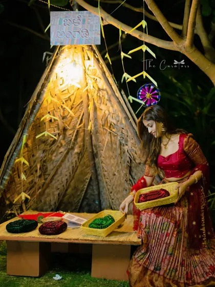 We love adding unique, interactive elements to your celebration. This charming 'Balle Angadi' or village bangle shop, served as a delightful photobooth and a memorable experience for guests.