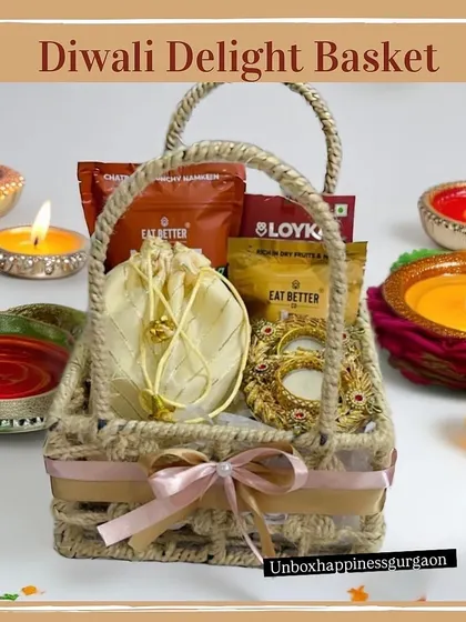 This view of the 'Diwali Delight' basket shows the arrangement of items, including healthy snacks from Eat Better and a 'Happy Diwali' card.