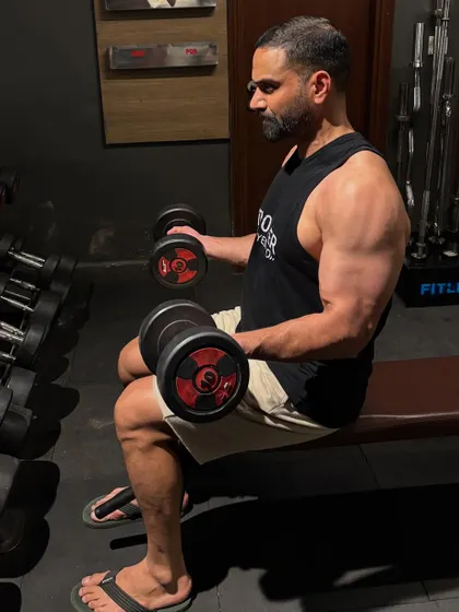Dumbbell curls are a useful accessory exercise. While not a primary lift, strong biceps are important for pulling motions in grappling and can help prevent injury.