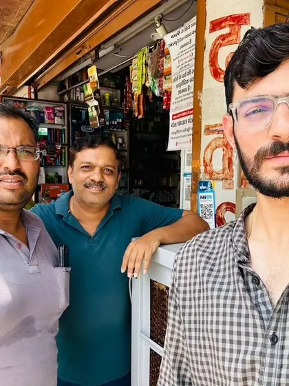 Our team member takes a selfie with two customers in their shop.