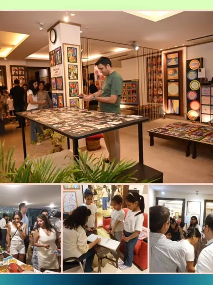 Our exhibition is an interactive experience, with guests enjoying refreshments, signing our guest book, and taking a close look at the detailed artwork on display.