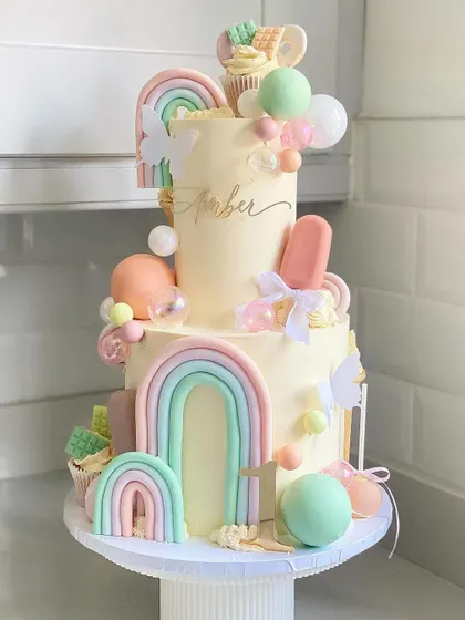 A different perspective on the "Sweet One" cake, showing off all its sweet details.
