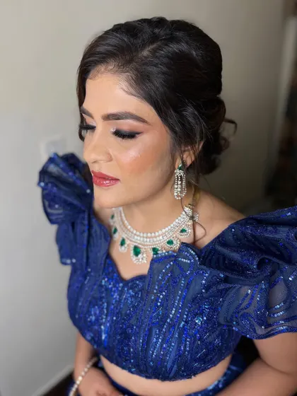 A no-filter, no-edit kind of look. This client is ready for her reception in a stunning royal blue outfit, with makeup that is blended to perfection.