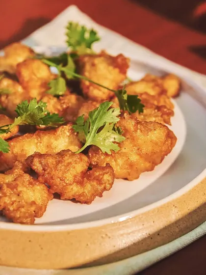 Comfort food at its finest. My lobster fritti are creamy on the inside with a golden crust, glazed with a curry leaf, heeng, and mustard seed mixture.