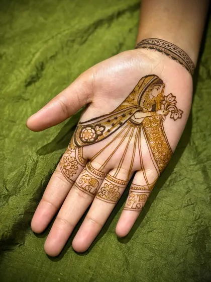 A duplicate of image 28, this minimalist 'dulhan' design is perfect for someone who wants a touch of figurative art without the full heavy bridal pattern.