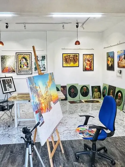 Another view of the studio, with an easel and painting in progress at the center. The space is organized to inspire creativity, with good lighting and my work surrounding me.