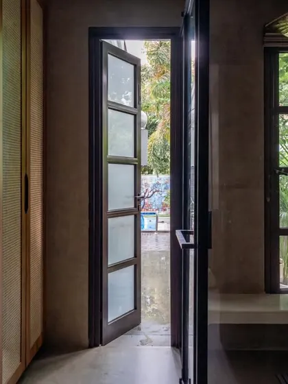 We designed this bathroom to open up to a private garden, creating a spa-like experience. The walk-in shower with a built-in bench and large windows allows you to feel connected to nature while you unwind.
