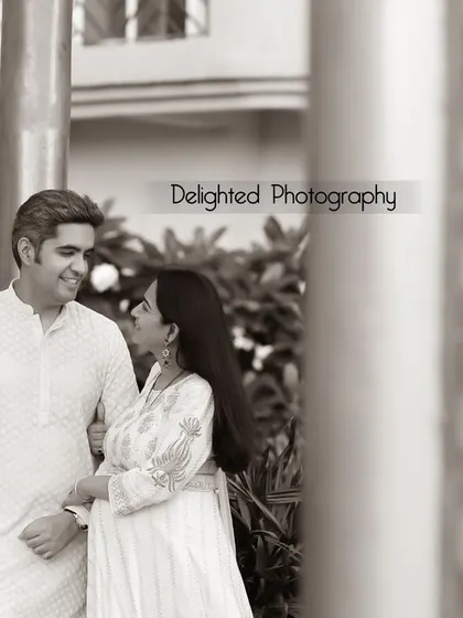 A timeless black and white portrait of the couple. Their classic outfits and the simple, elegant composition make this a photo they will cherish forever.