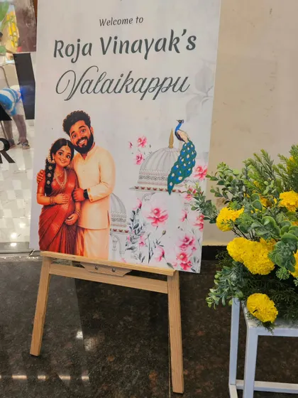 To make the welcome special, we designed this custom board featuring a lovely caricature of the parents-to-be, Roja and Vinayak. It’s these personal touches that help tell your unique family story.