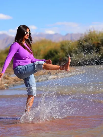 Having some fun while cooling off. A playful kick in the water is a great way to unwind after an intense workout.
