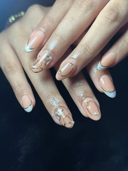 The pearl accents add a touch of elegance to this abstract gold and nude design.