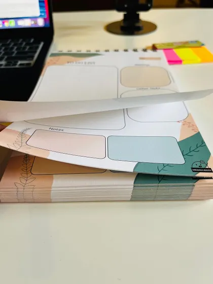 Showing the thickness of the 'To Do List' pad, which contains 100 sheets for planning and 100 plain sheets for notes.