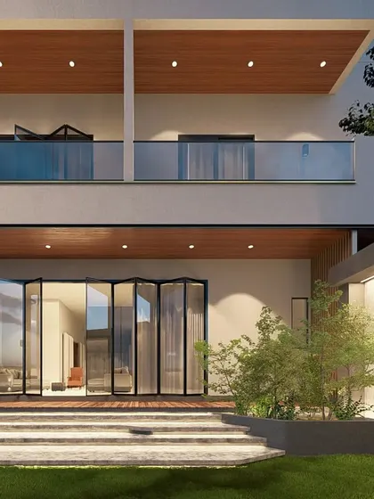 Here, you can see the use of accordion glass doors at 'The Honest House'. This feature allows the living space to completely open up to the garden deck, truly merging the indoor and outdoor environments.