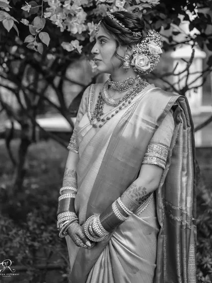 Another angle of this gorgeous bride, captured in black and white to emphasize the texture and elegance of her attire.