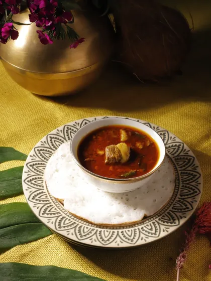 A hearty mutton stew served with a soft appam. This is a quintessential dish from our Easter menu, offering rich, comforting flavors that are perfect for a family gathering.