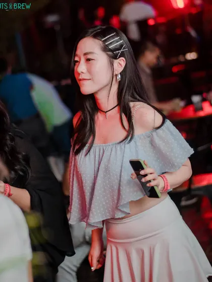 Another stylish guest enjoying the music and atmosphere.