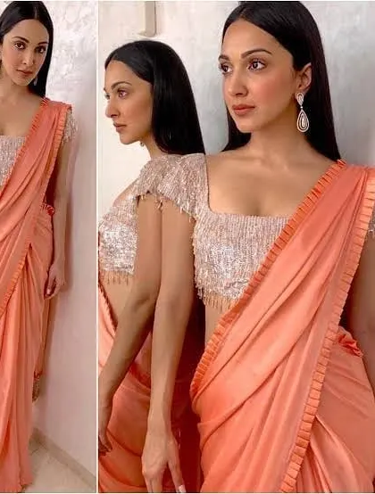 This sequined blouse with a square neckline and delicate tassel details on the sleeves is perfect for party wear. I ensure the sequins are stitched securely for a neat finish.