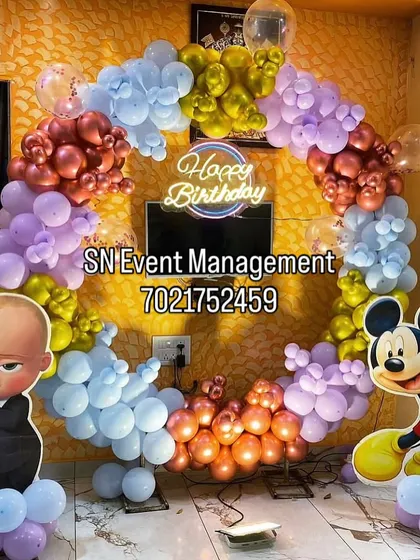 A fun mixed-character theme featuring Boss Baby and Mickey Mouse. The colorful balloon ring arch and character cutouts make for a playful and unique birthday decoration.