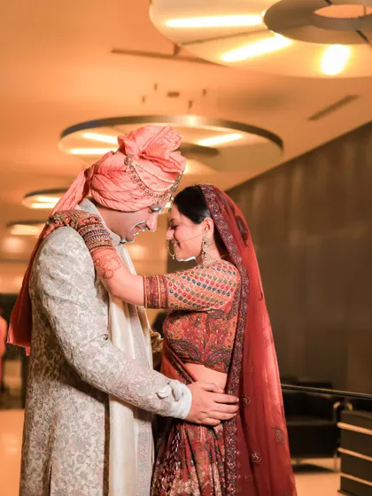 A candid and happy interaction between the couple. We focus on capturing these unposed moments of love and laughter that truly define the wedding day.