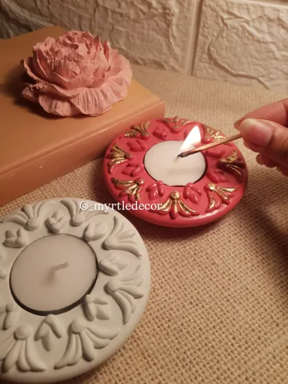The simple act of lighting a diya can bring so much warmth. Here is one of our ornate Jesmonite T-light holders, hand-painted with gold accents to catch the light beautifully. It’s a small piece designed to make a big impact during the festive season.