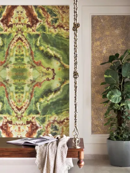 A detail shot of the solid wood swing and its custom tile backdrop, a perfect example of blending bold patterns with traditional elements.