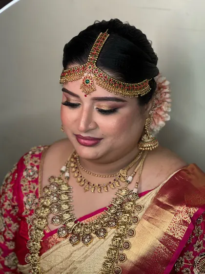 Another beautiful close-up of Aishwarya's bridal makeup. The focus is on enhancing her eyes and creating a soft, diffused glow on the skin that looks stunning in any light.