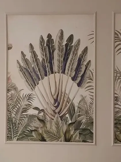 Another example of a triptych panel installation, this time featuring a collection of tropical leaves and a central seashell motif.