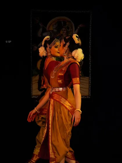 An artistic, mirrored pose from the Ardhanareeshwara duet, symbolizing the two halves of a whole. This was captured during our World Dance Day recital.