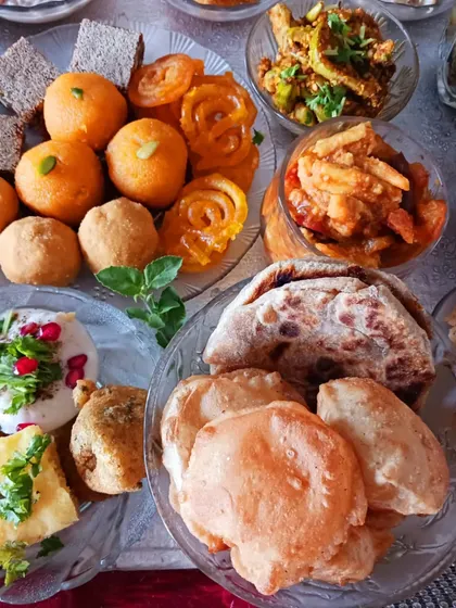 The heart of the feast, featuring vegan motichoor laddoos, jalebis, pooris, and dahi pakodi made with plant-based yogurt.